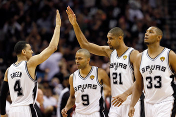 SAN ANTONIO, TX - JUNE 16:  (L-R) Danny Green #4, Tony Parker #9, Tim Duncan #21 and Boris Diaw #33 of the San Antonio Spurs celebrate in the fourth quarter against the Miami Heat during Game Five of the 2013 NBA Finals at the AT&T Center on June 16, 2013 in San Antonio, Texas. NOTE TO USER: User expressly acknowledges and agrees that, by downloading and or using this photograph, User is consenting to the terms and conditions of the Getty Images License Agreement.  (Photo by Kevin C. Cox/Getty Images)
